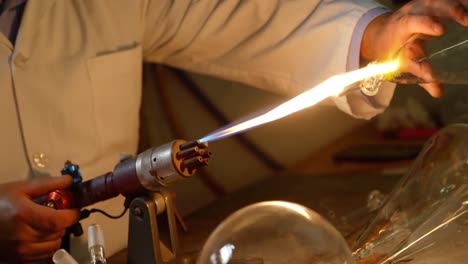 mid section of male worker creating glass in glass factory 4k