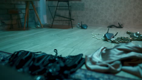 messy room with scattered clothing and accessories