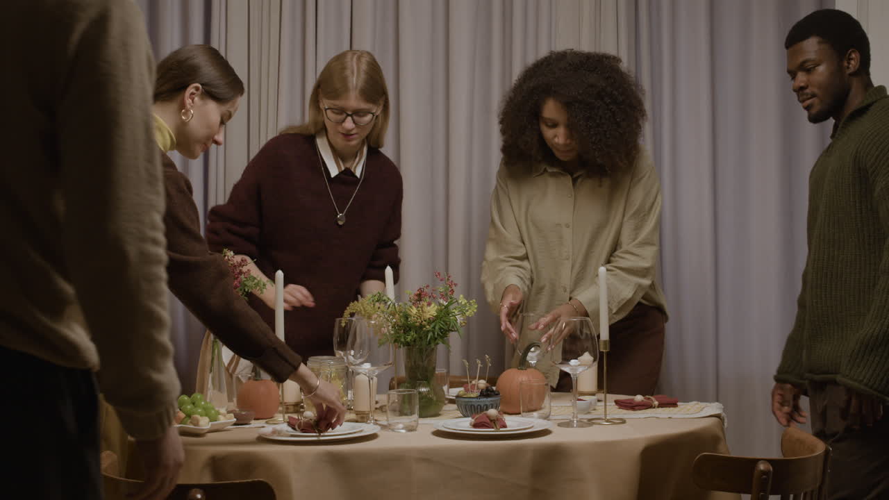 People Gathering Around a Dinner Table