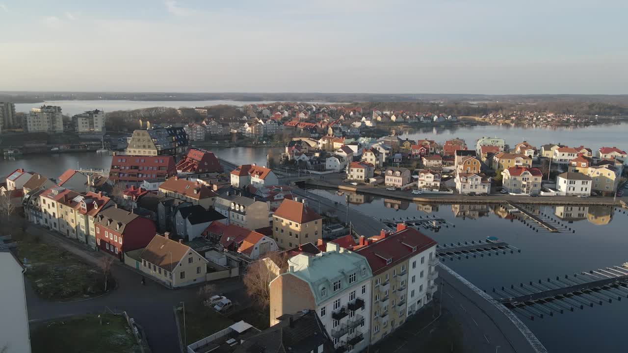 Aerial footage on a cold winter day in Karlskrona, Sweden with a view of some empty docks and the beautiful island Bjorkholmen and Ekholmen next to it