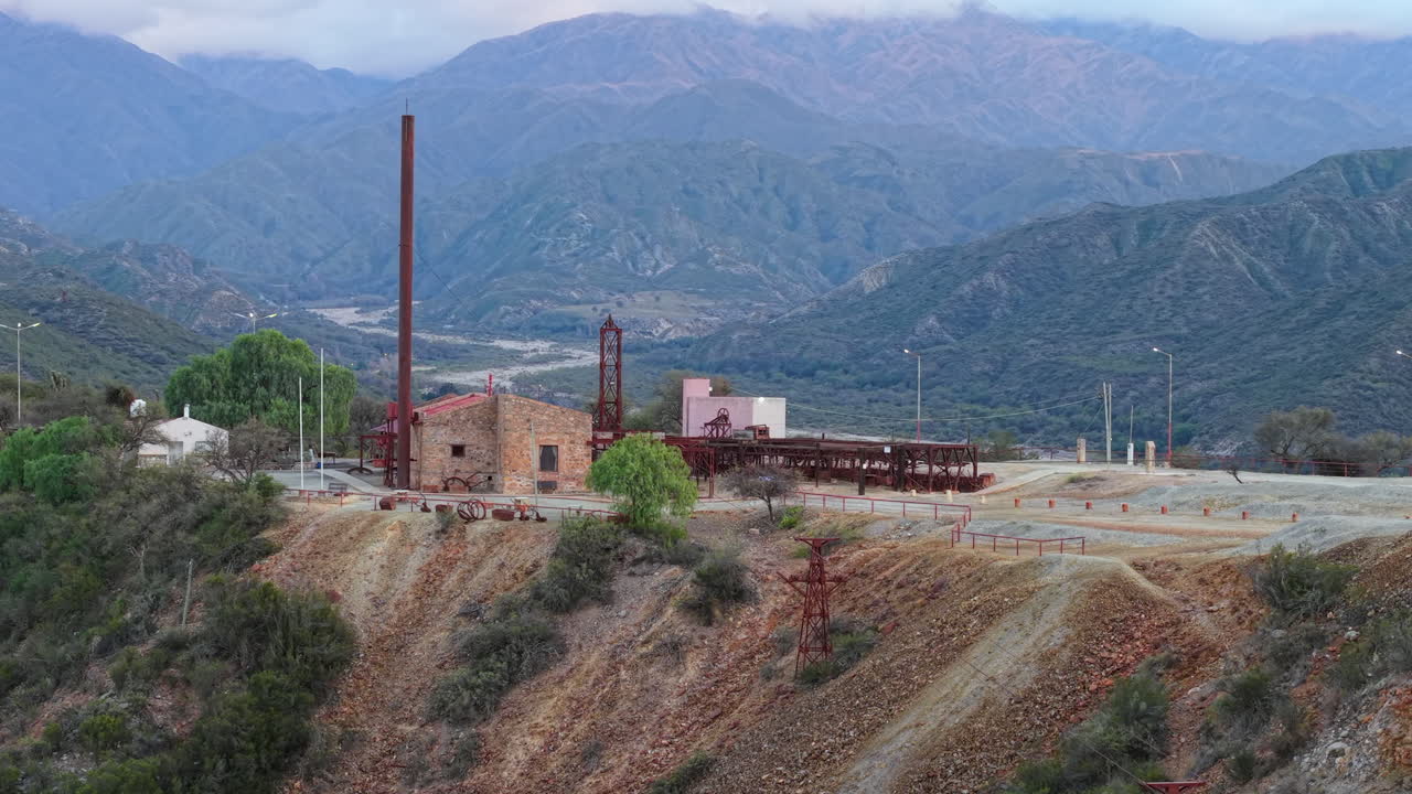Historic mining complex and chimney at Estación 2 Cable Carril, with mountains in Chilecito, La Rioja, Argentina