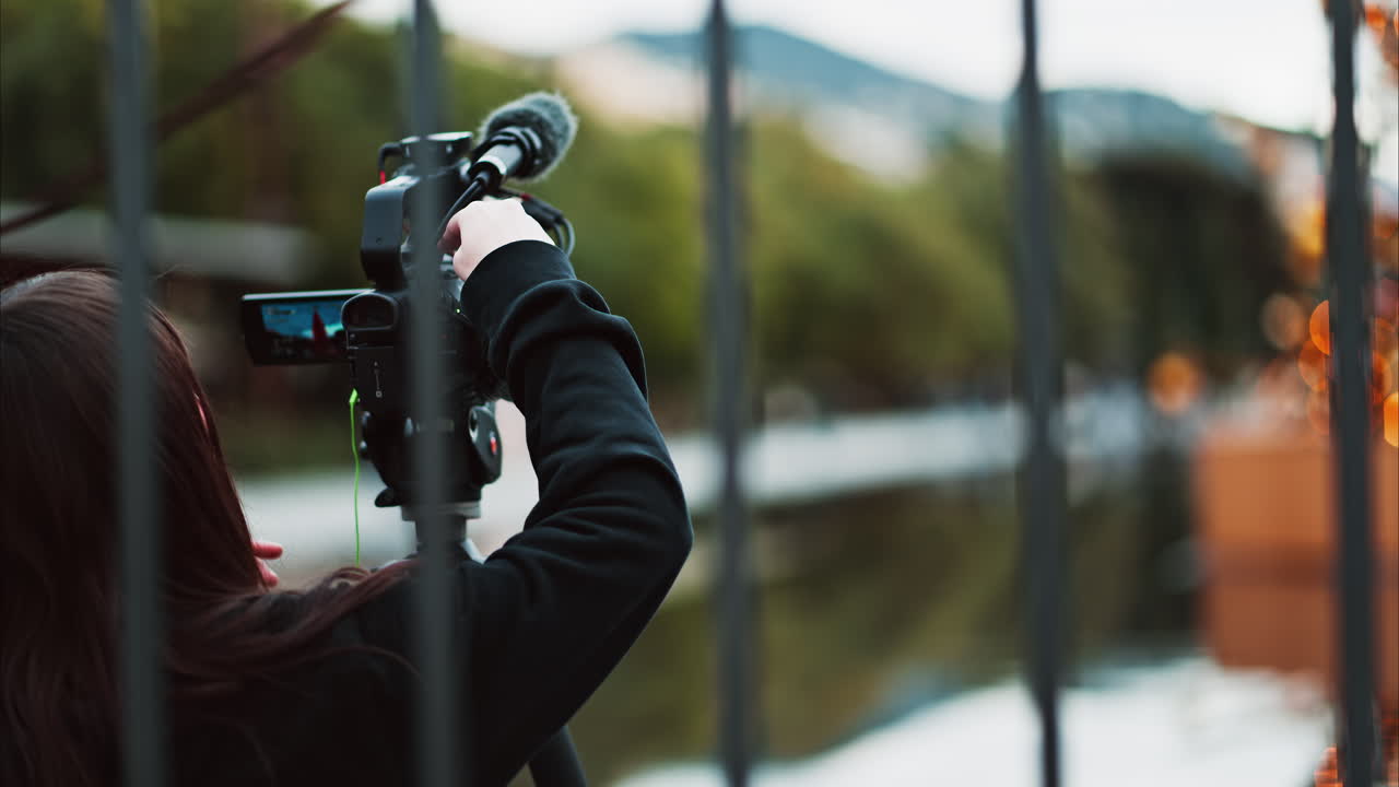 Nice, France - December 14, 2024: Two girls filming people walking through Place Massena in daylight