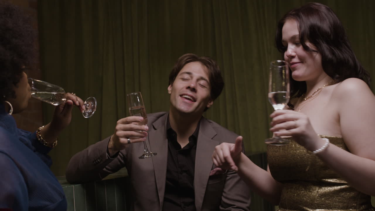 Group of friends toasting with champagne at a party