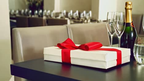 gift box with champagne and glasses