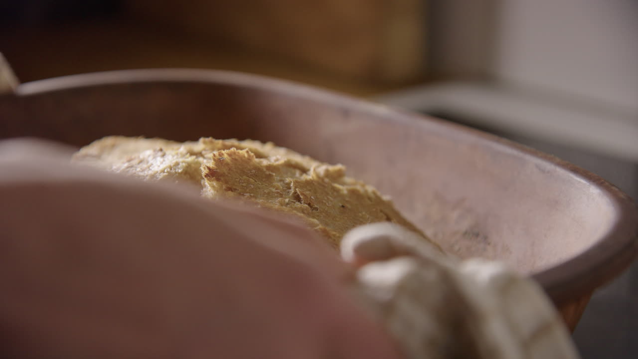 BAKING - Freshly baked sourdough bread, slow motion close up