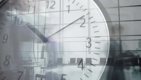 people walking fast with clock in the foreground