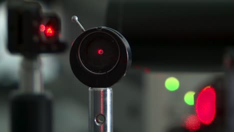 red laser beam in photonic lab