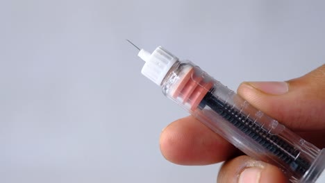 insulin injection pen in hand