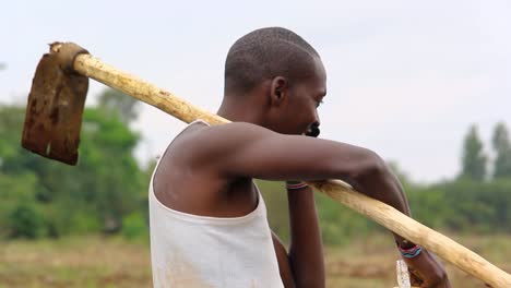 male farmer speaking on mobile phone feeling happy and excited in a plantation