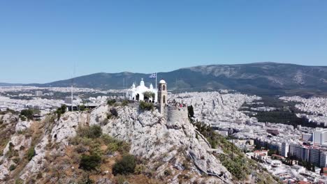 orbiting drone video of mount lycabettus, in athens, greece