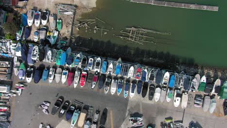 small boats in dry dock storage at hebe haven pier, hong kong, aerial view