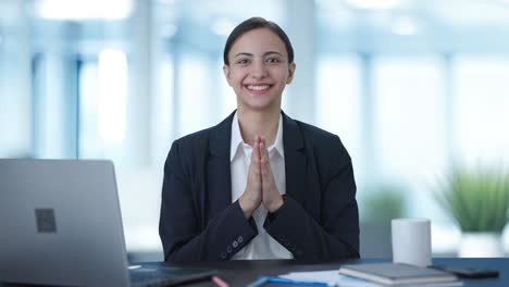 Happy-Indian-business-woman-doing-Namaste