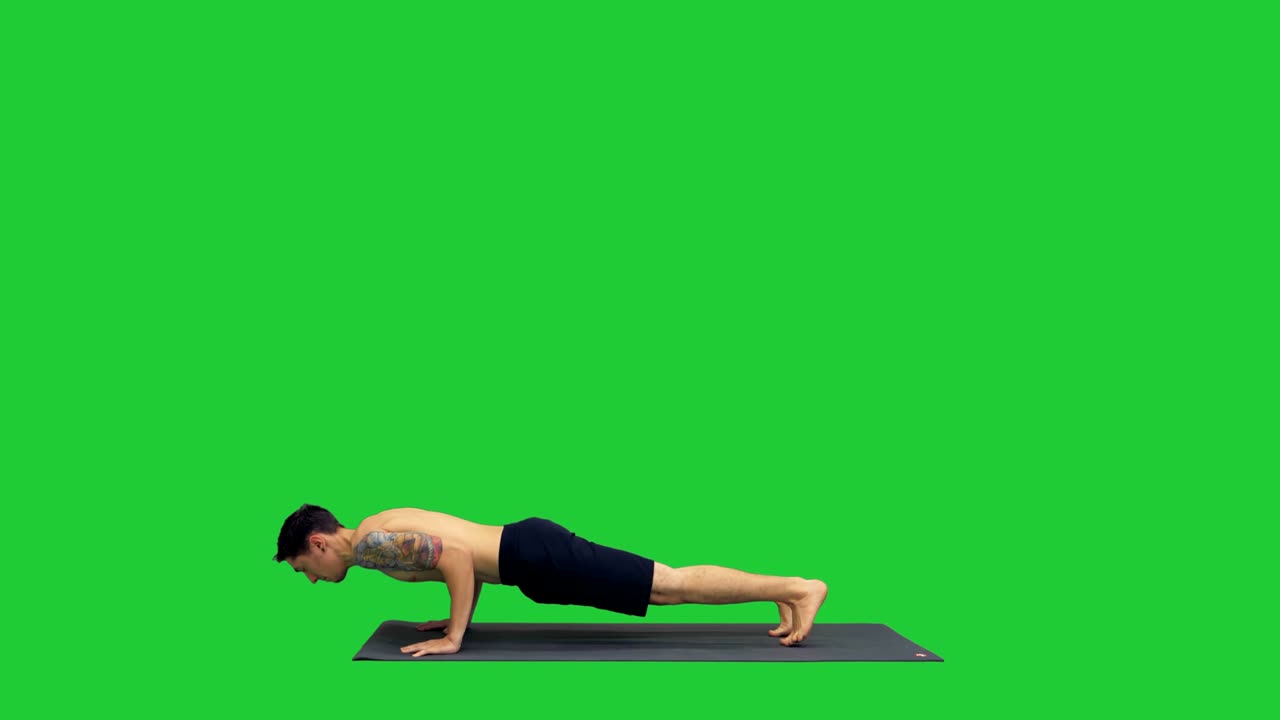 Young man doing yoga on a Green Screen, Chroma Key