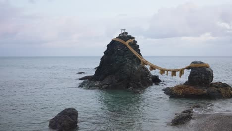 meoto iwa wedded rocks on the coastline of mie at low tide