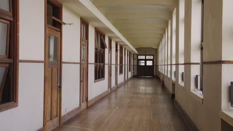 long hallway in empty school, panning shot 4k