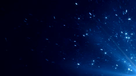 hermosas chispas mágicas que surgen de un gran fuego en el cielo nocturno. partículas brillantes de color azul aisladas abstractas en movimiento lento de fondo negro. animación en bucle 3d.