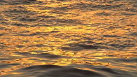 reflection of orange sky on sea surface