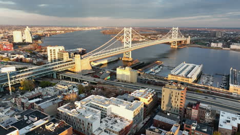 beautiful establishing shot of ben franklin bridge between philadelphia and camden, new jersey