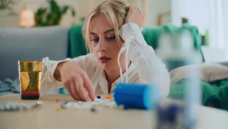 desperate girl takes pills to calm