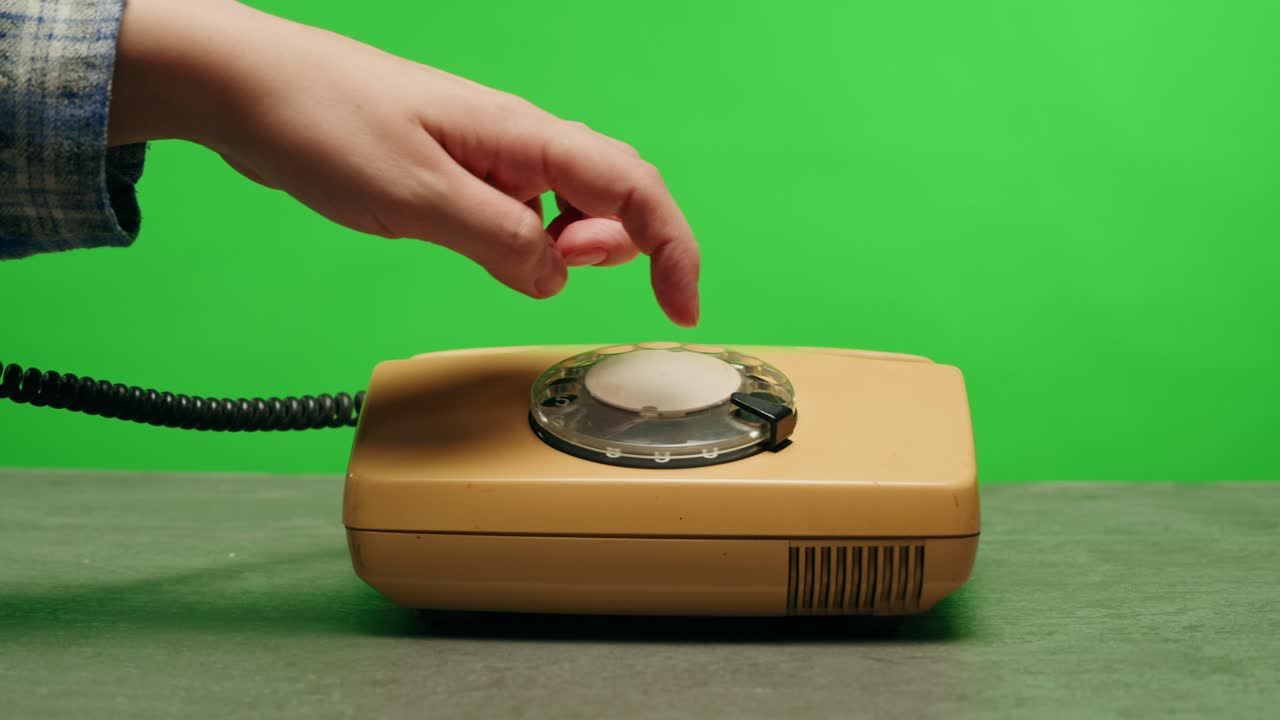 Retro vintage phone, A yellow rotary telephone is displayed on a wooden desk, adding a nostalgic touch