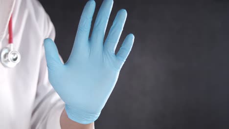 doctor wearing protective gloves