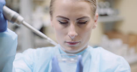 Scientist-Using-Pipette-During-Experiment-At-Laboratory-1