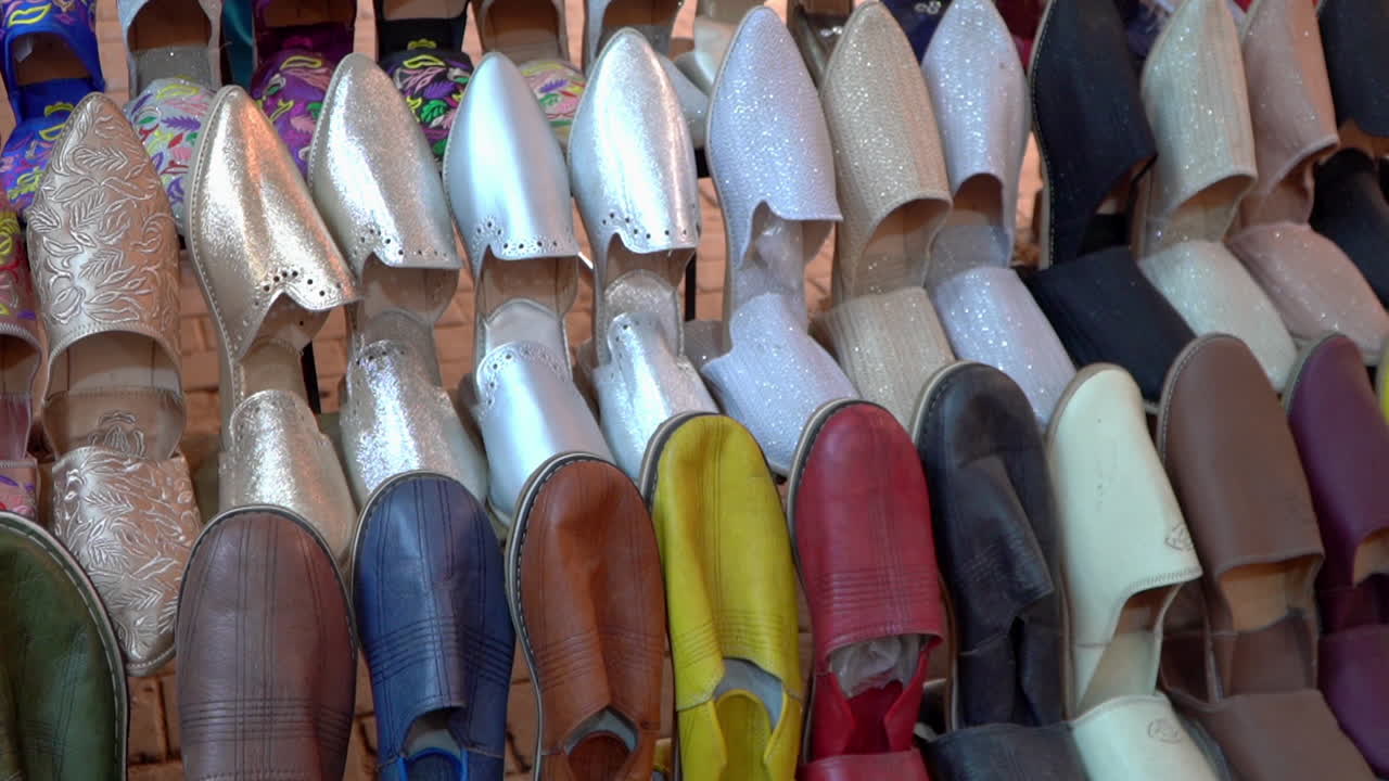 Discover the rich heritage of Morocco with authentic belgha leather shoes in Marrakech's vibrant old medina market