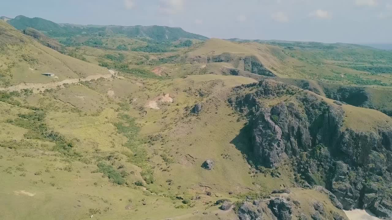 Aerial View of Rolling Hills and Mountains