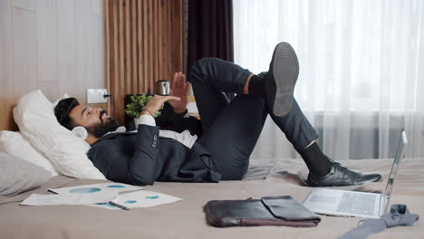 businessman relaxing in hotel room