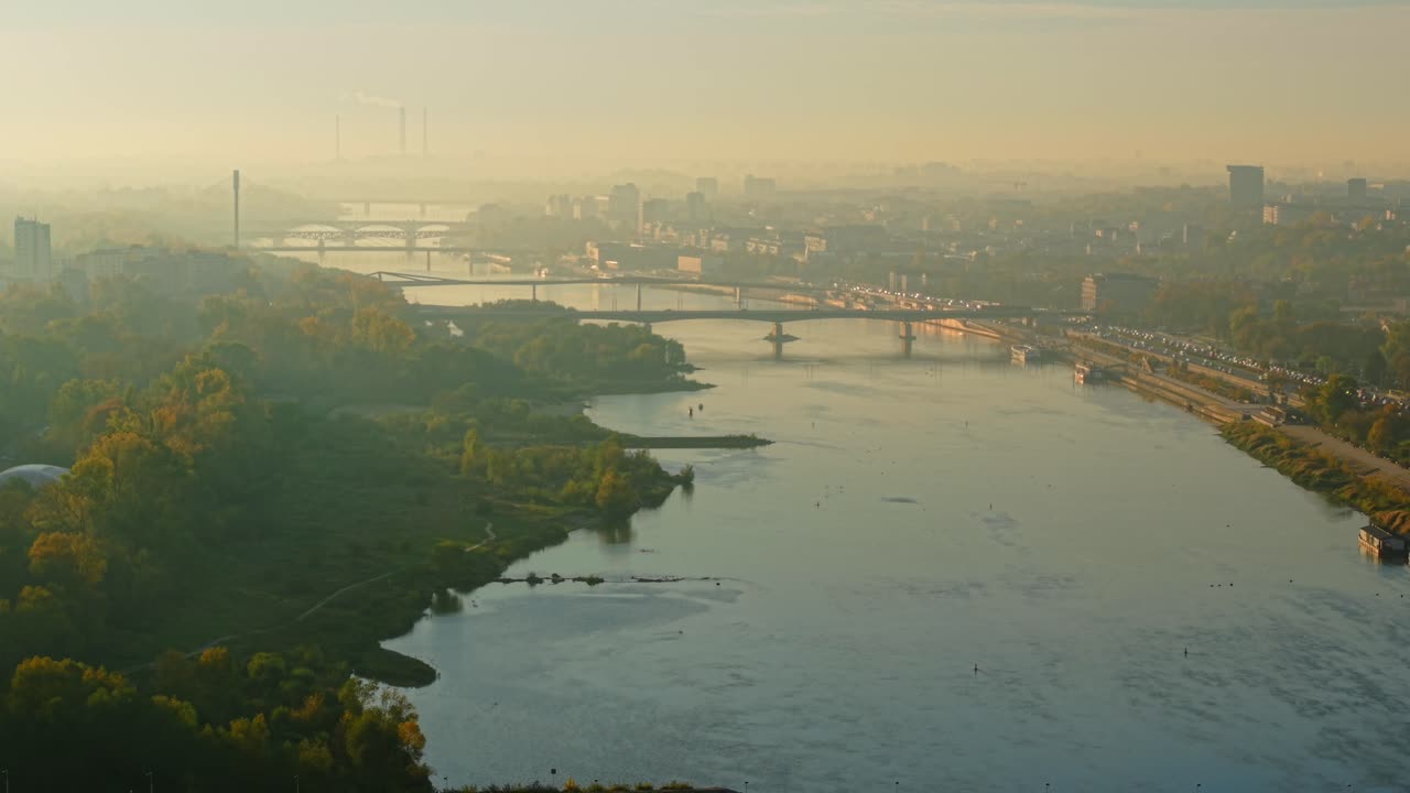 Aerial View of Cityscape with River and Bridges on a Foggy Morning