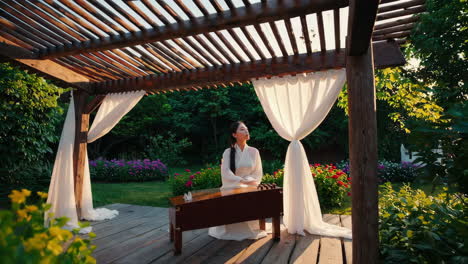 woman playing traditional instrument in a serene garden