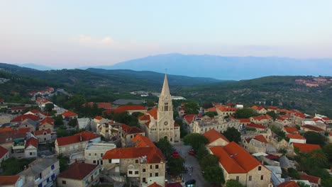 descending aerial view of st, nicholas church in selca croatia europe