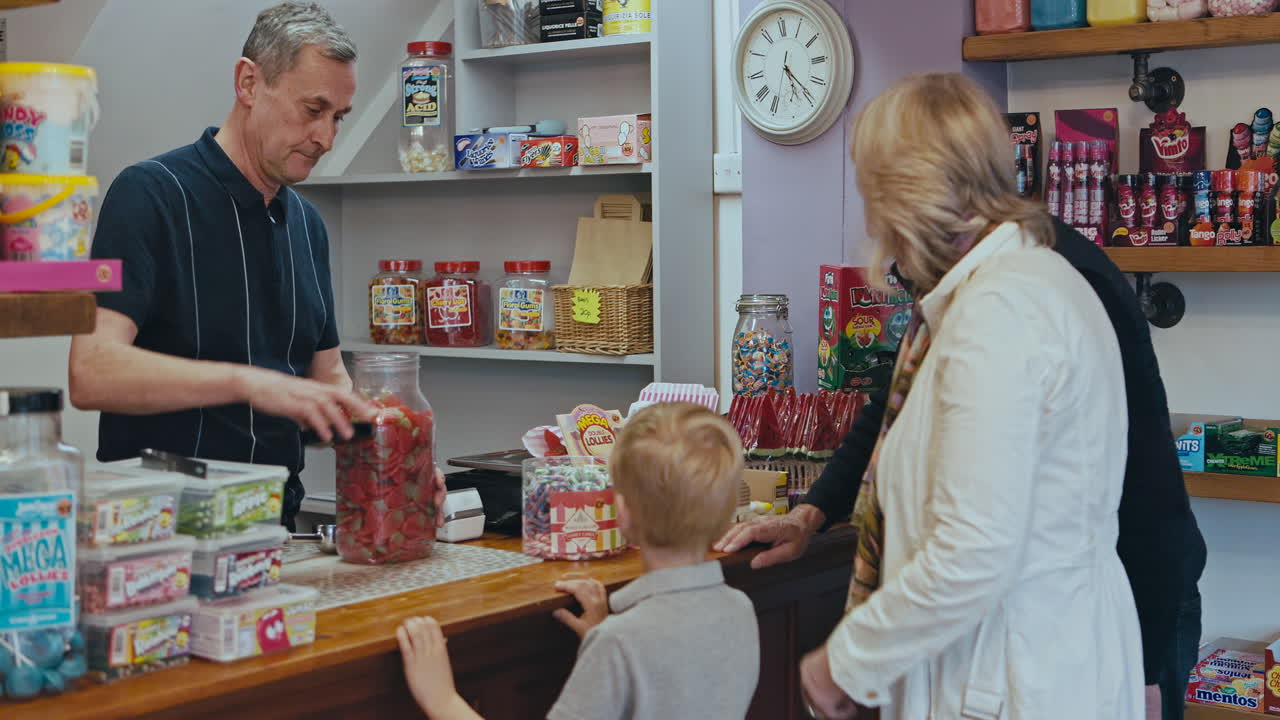 People buying candy at a candy store
