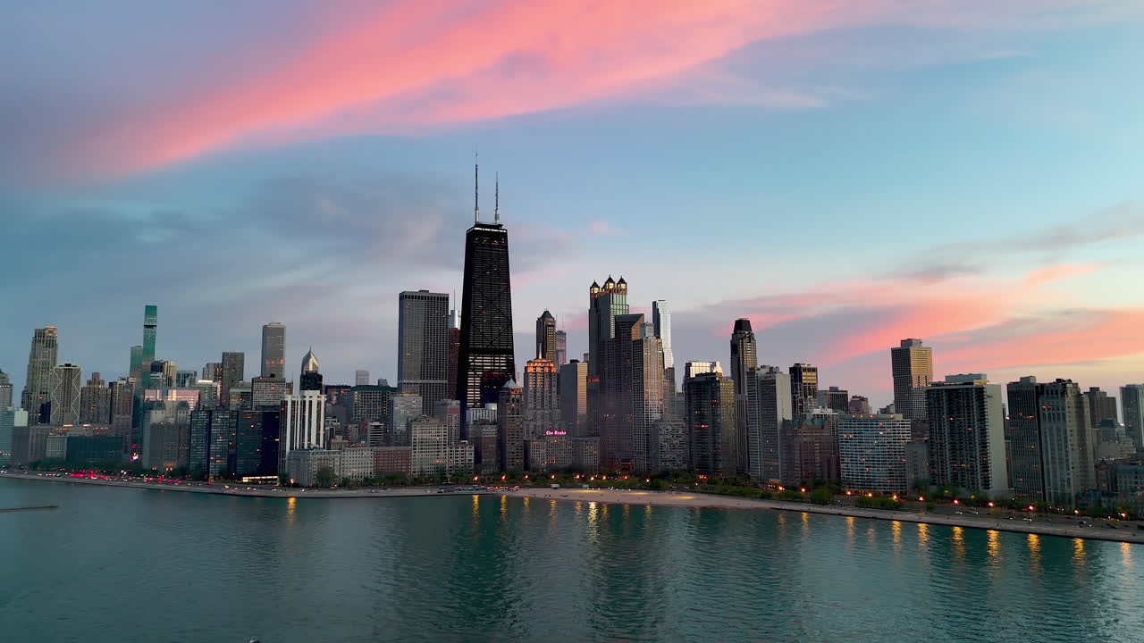 Aerial view rotating in front of Streeterville, colorful evening in Chicago