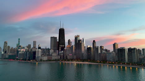 aerial view rotating in front of streeterville, colorful evening in chicago