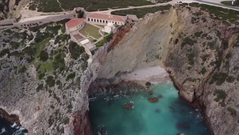 top-down view of the beautiful turquoise foamy waves of the magnificent ocean and the impressive limestone cliffs