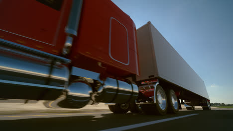 Animation-of-riding-the-18-wheel-delivery-red-truck-with-trailer.-The-heavy-monster-of-every-pathway.-High-distances-beautiful-cargo-transporter.-Inspiring-cloudless-blue-sky-background.-HD