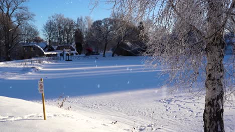 Frozen-lake-and-sign-forbidding-to-step-on-it-during-snowfall