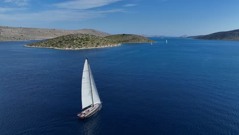 sailboat sailing in the mediterranean sea in kornati, croatia. - aerial shot
