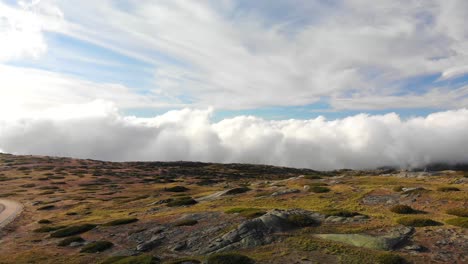 Mountain-summit-with-a-view-above-the-clouds