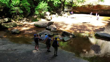 hikers stop to enjoy the view at hocking hills state park in ohio