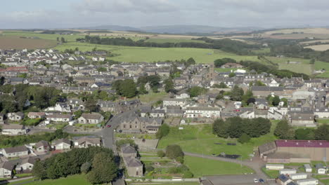 an aerial view of inverbervie looking over the town from the sea on a sunny summer's day