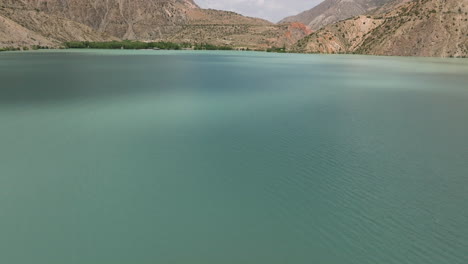 Iskanderkul-Lake-With-Tranquil-Waters-In-Tajikistan---aerial-shot