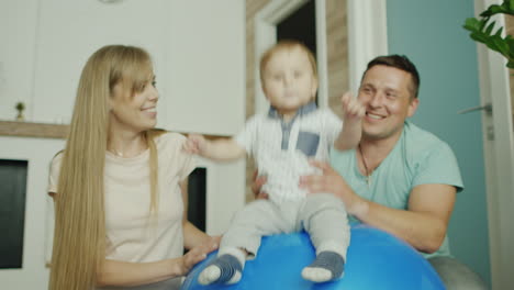 Young-Caucasian-Parents-Play-With-Their-Baby-Boy