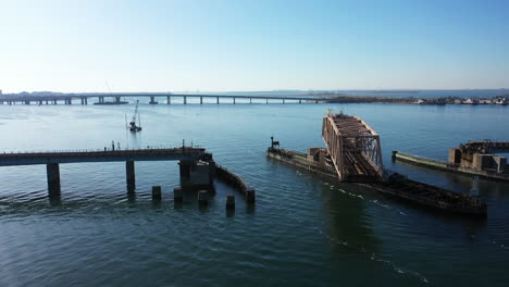 an low angle shot of a swing bridge opening on a bay in queens, ny