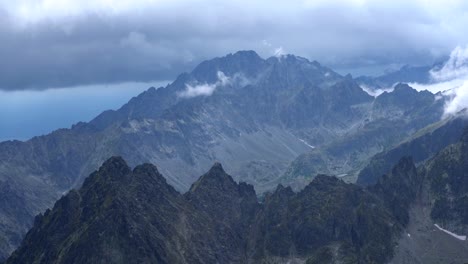 Dark-dense-clouds-sweep-across-jagged-mountain-tops-of-the-High-Tatras-timelapse