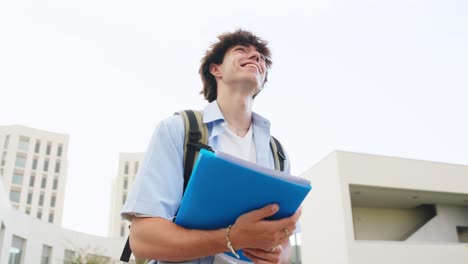 Student with backpack and books on campus