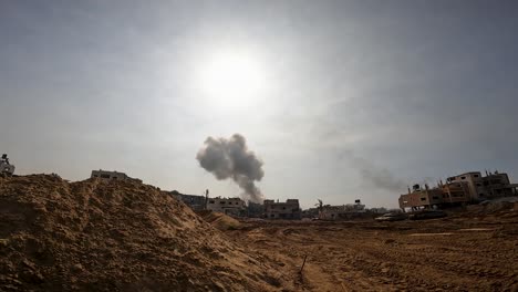 Panning-shot-of-smoke-from-an-Israeli-army-bomb-explosion-in-a-civilian-neighborhood-in-the-Gaza-strip