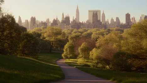 winding path through a park with city skyline in the background