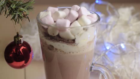 whipped cream and marshmallows toppings on hot chocolate drink at christmas